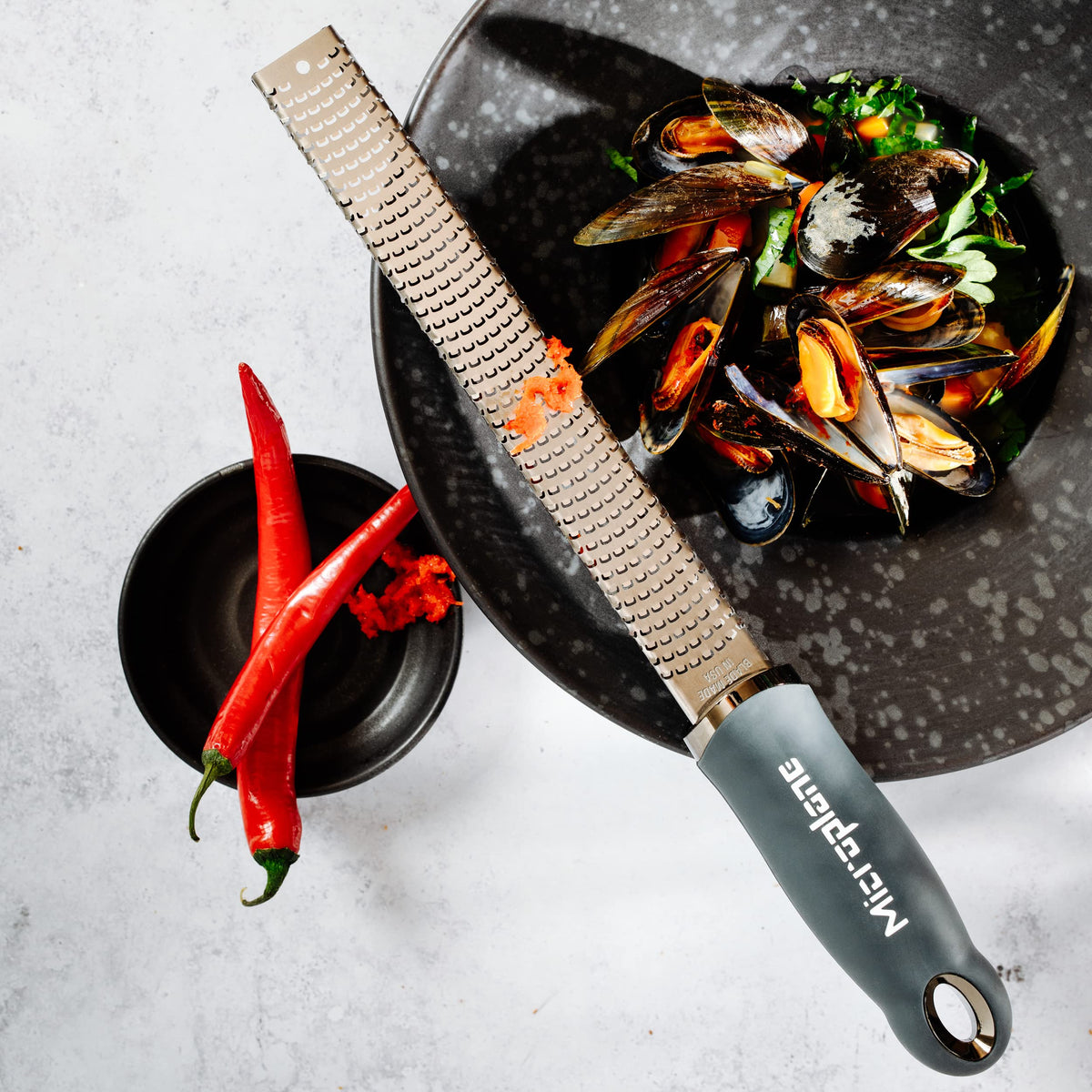 Microplane Premium Zester Grater garlic minced paste ready to cook.