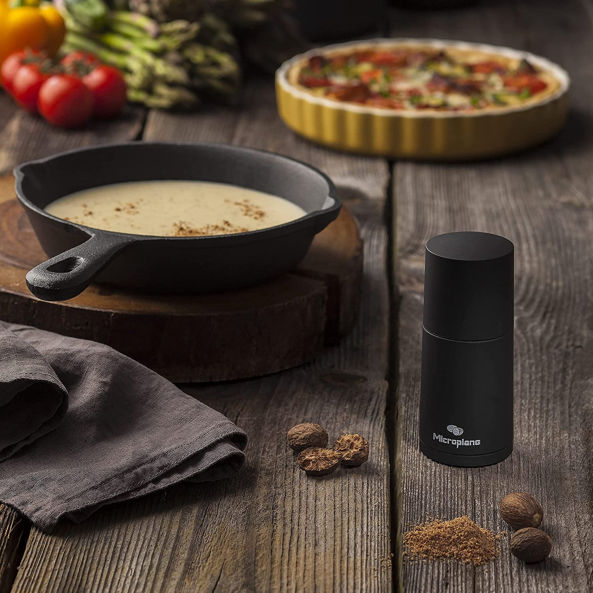 Microplane spice mill easy-clean angle shows simple rinse after use.