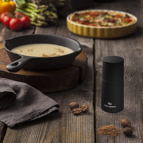 Microplane spice mill easy-clean angle shows simple rinse after use.