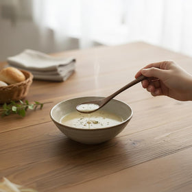 MIGAKU HOME wooden spoons on table setting highlighting durability and warm wood tone.