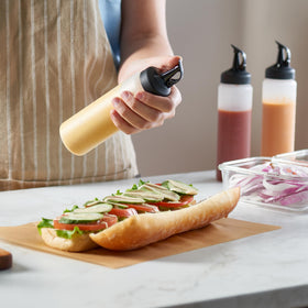 Clear plastic condiment containers ideal for oils, dressings, syrups, and sauces.