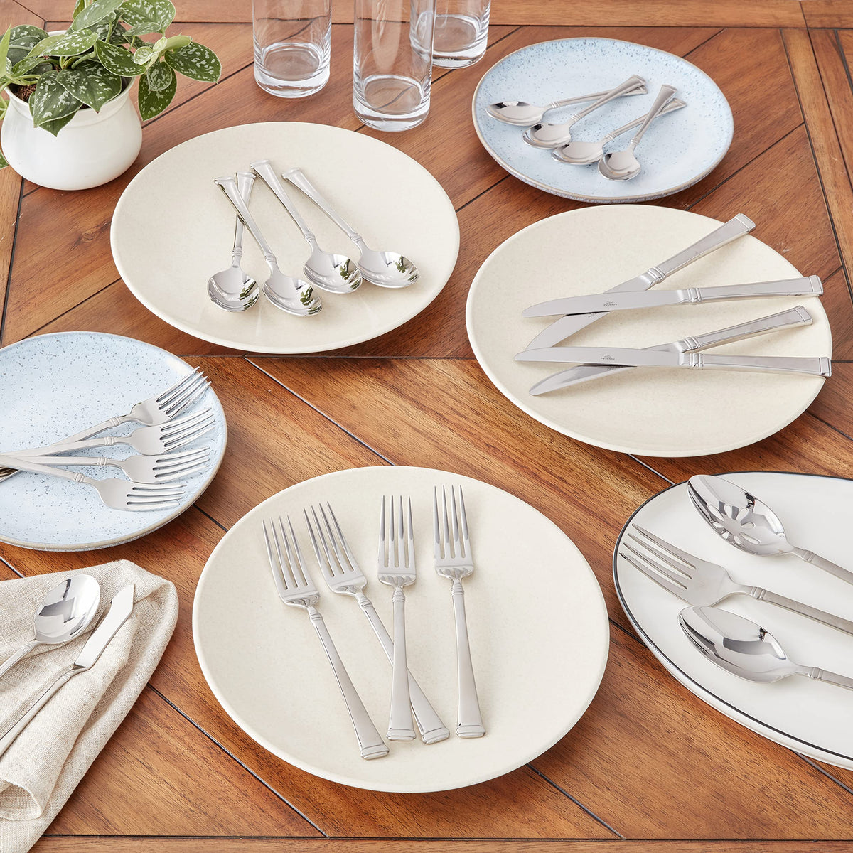 Close-up of Harmony handles showing tapered silhouette and high-luster finish.