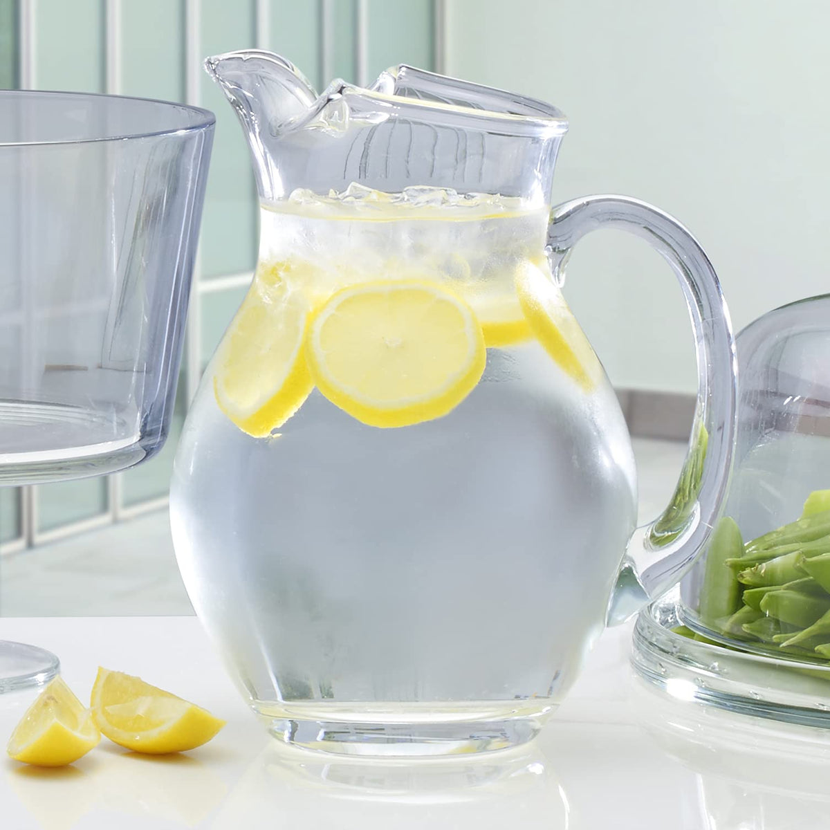 Mikasa Napoli glass pitcher being poured into a glass of iced tea