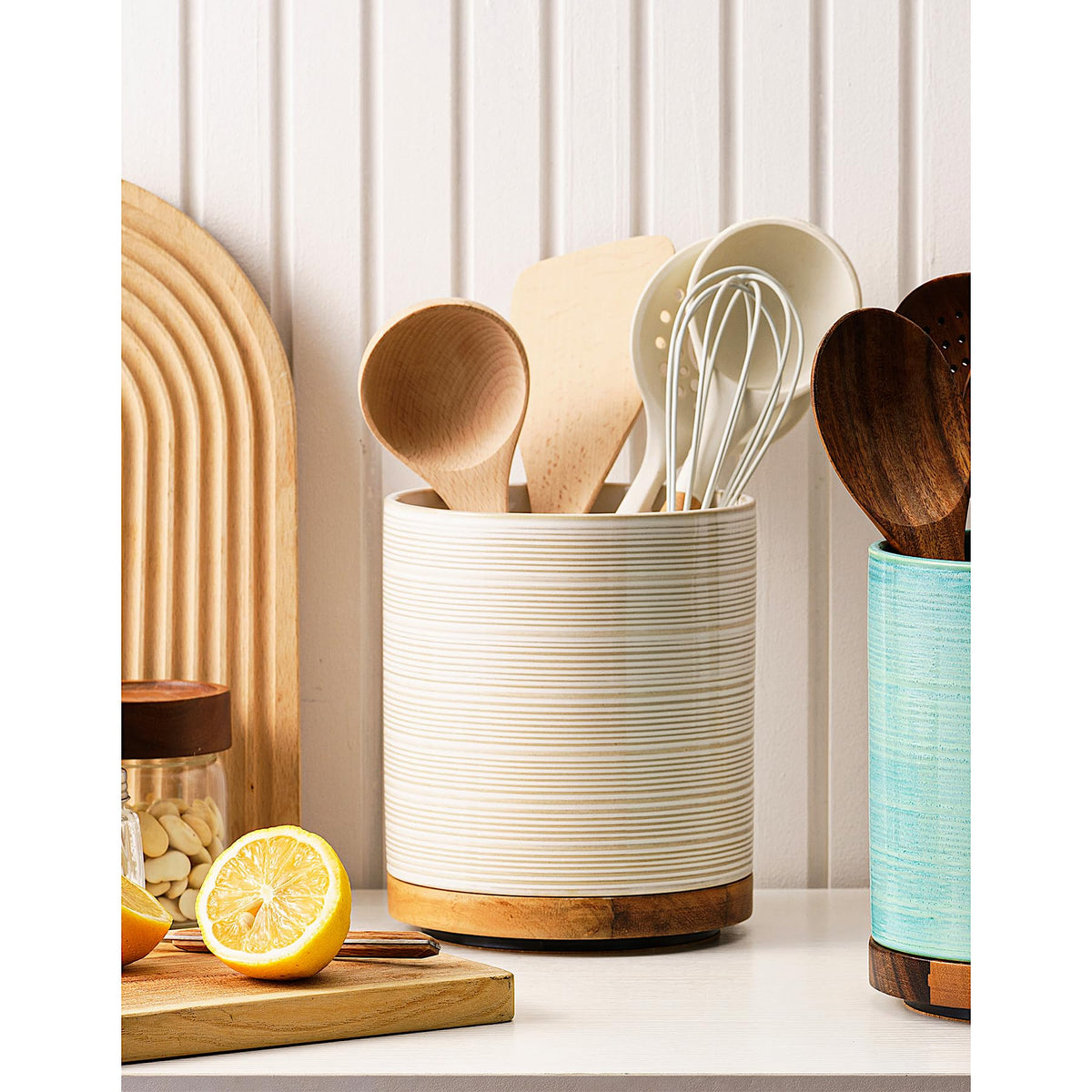 MIKIGEY Utensil Holder with rotatable wooden base provides stable support on busy kitchen counters.
