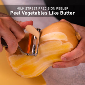 Milk Street Precision Peeler compact kitchen tool for versatile peeling.