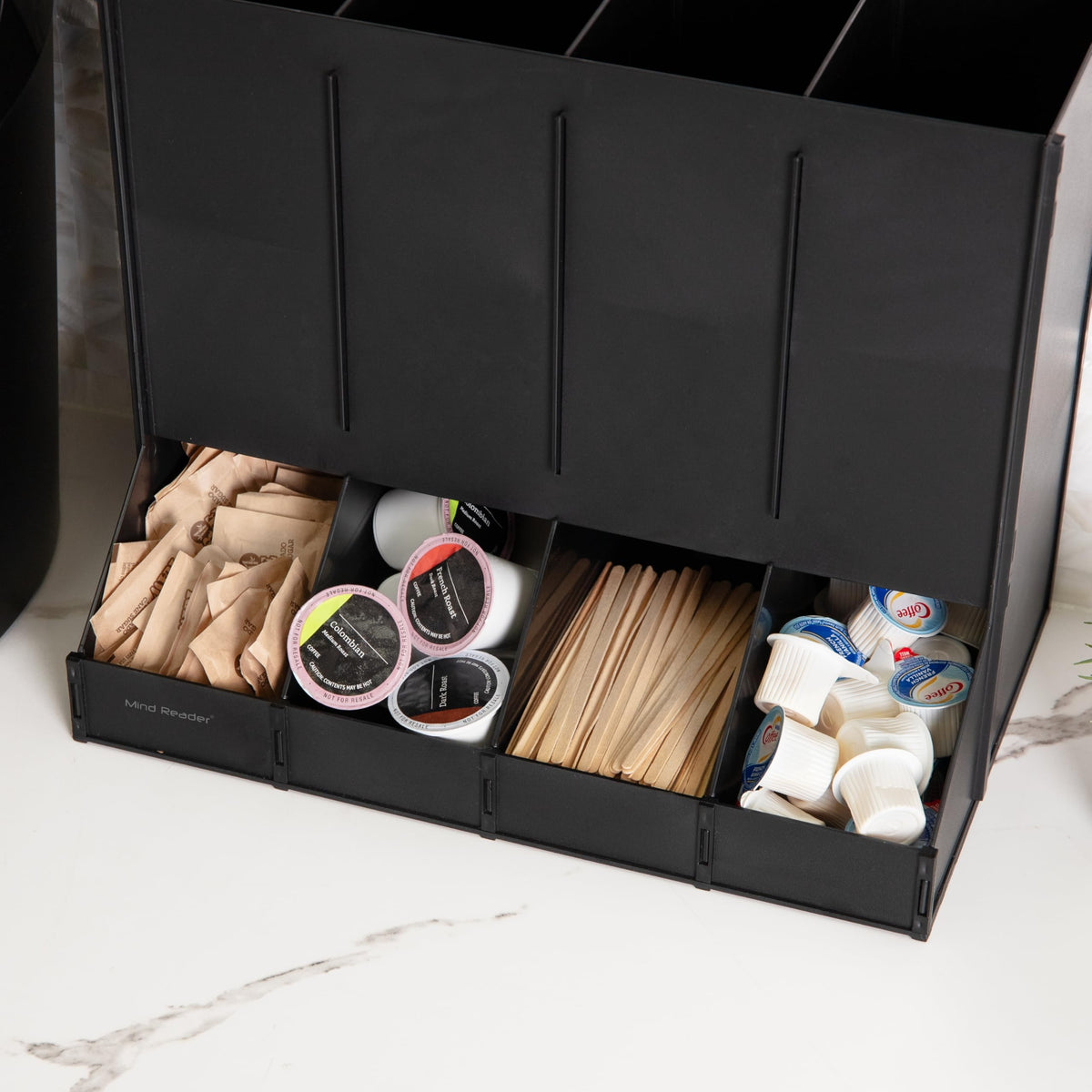 Mind Reader compact black coffee pod dispenser saves countertop space for busy kitchens.