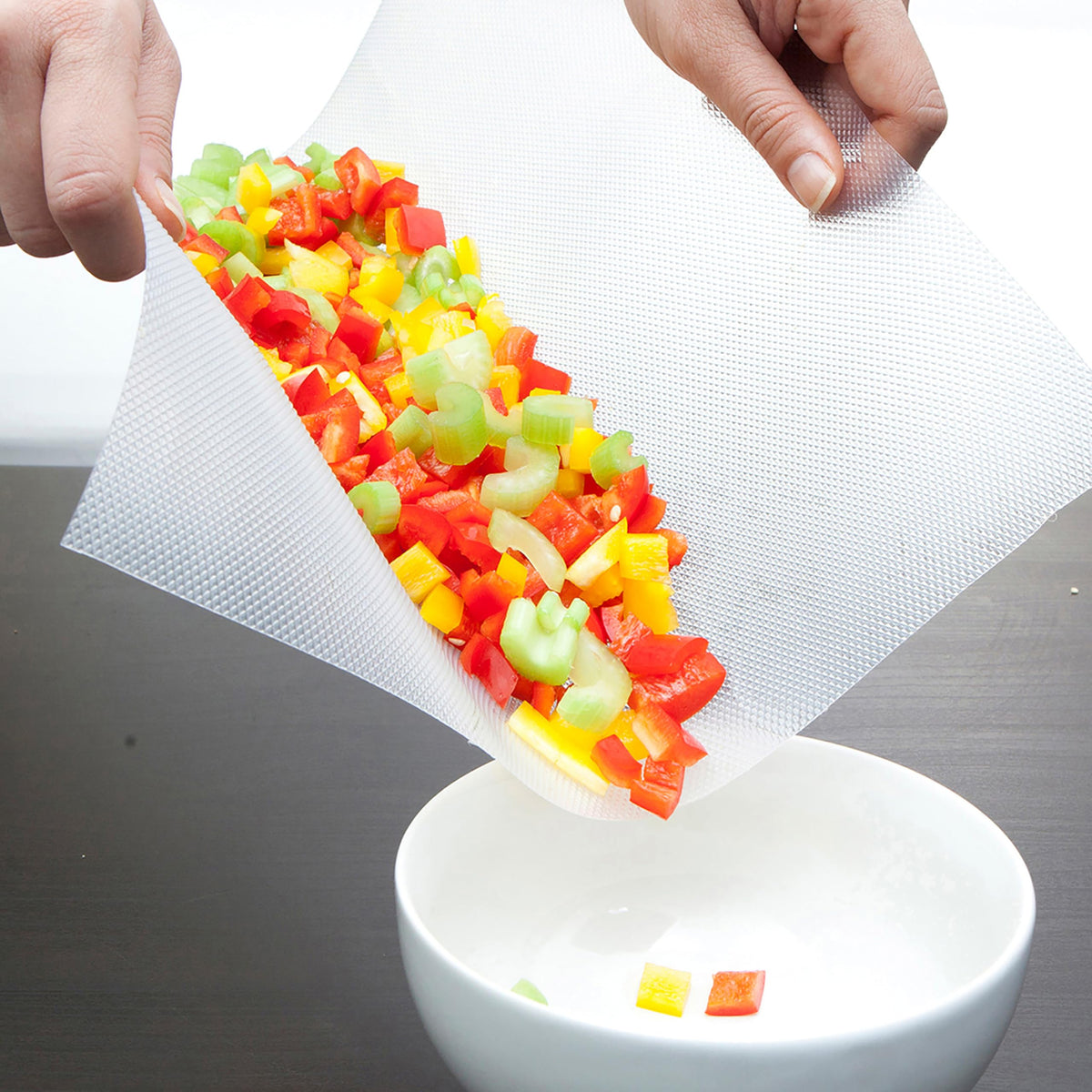 Mind Reader EZ Board durable and flexible for easy transfer of chopped ingredients.