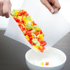 Mind Reader EZ Board durable and flexible for easy transfer of chopped ingredients.