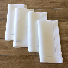 Minhcraft napkin corner detail highlighting mitered edge craftsmanship.