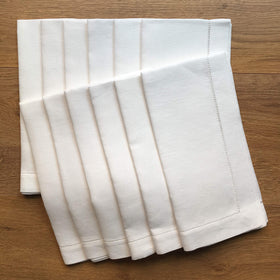 Minhcraft white linen hemstitch napkins, 20 x 20 inches, ready for an elegant dinner.