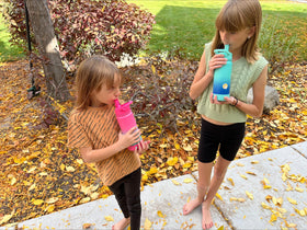 Mininoo kids bottle in purple-pink color stands out in backpacks