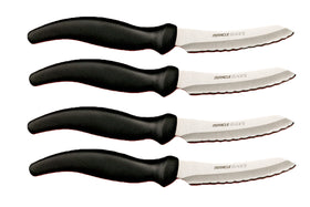 Miracle Blade III steak knife set on dining table, four-piece precision for meals.