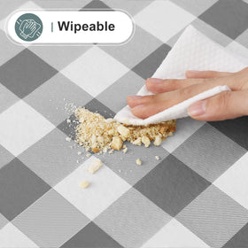 Misaya wipe-clean capability demonstrated with a damp cloth for quick refresh.