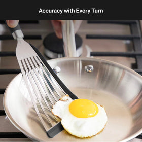 Misen Fish Spatula flipping eggs close-up shows delicate precise movement.