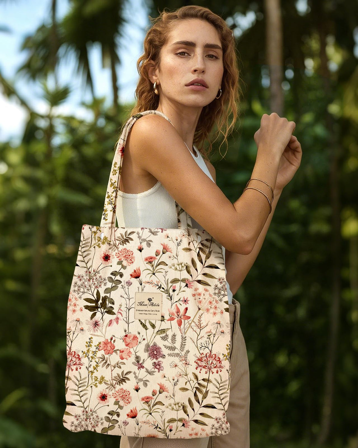 Miss Adola corduroy tote featuring secure buckle closures.