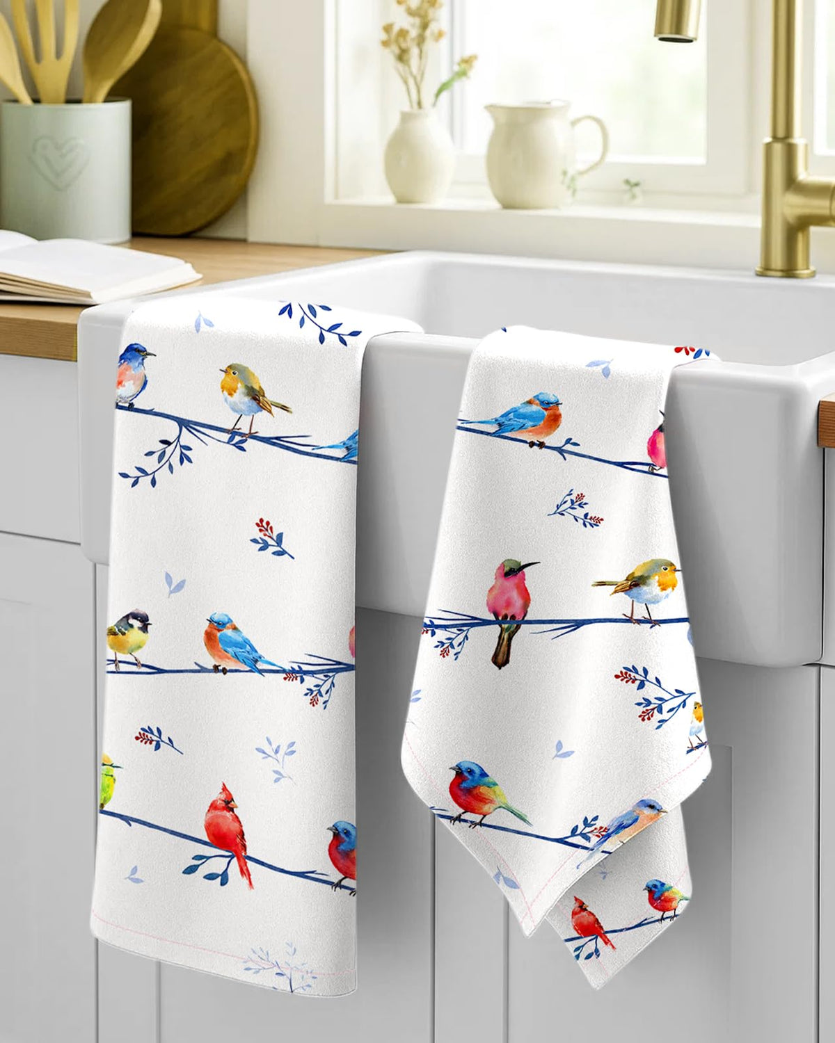 Miss Adola kitchen towels with hanging loop for convenient storage.