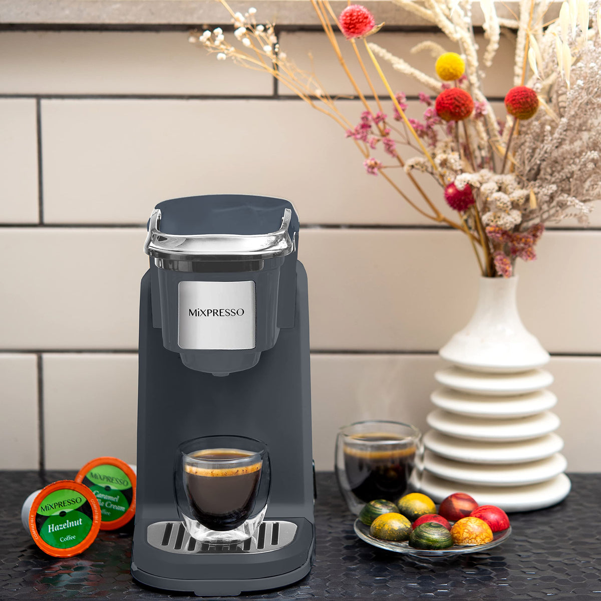 Mixpresso single cup brewer using ground coffee with optional reusable filter.