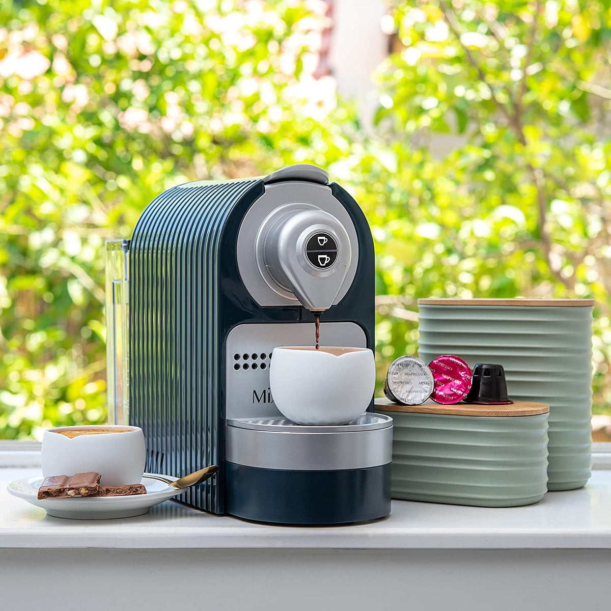 Mixpresso canisters for coffee, tea, and sugar in use