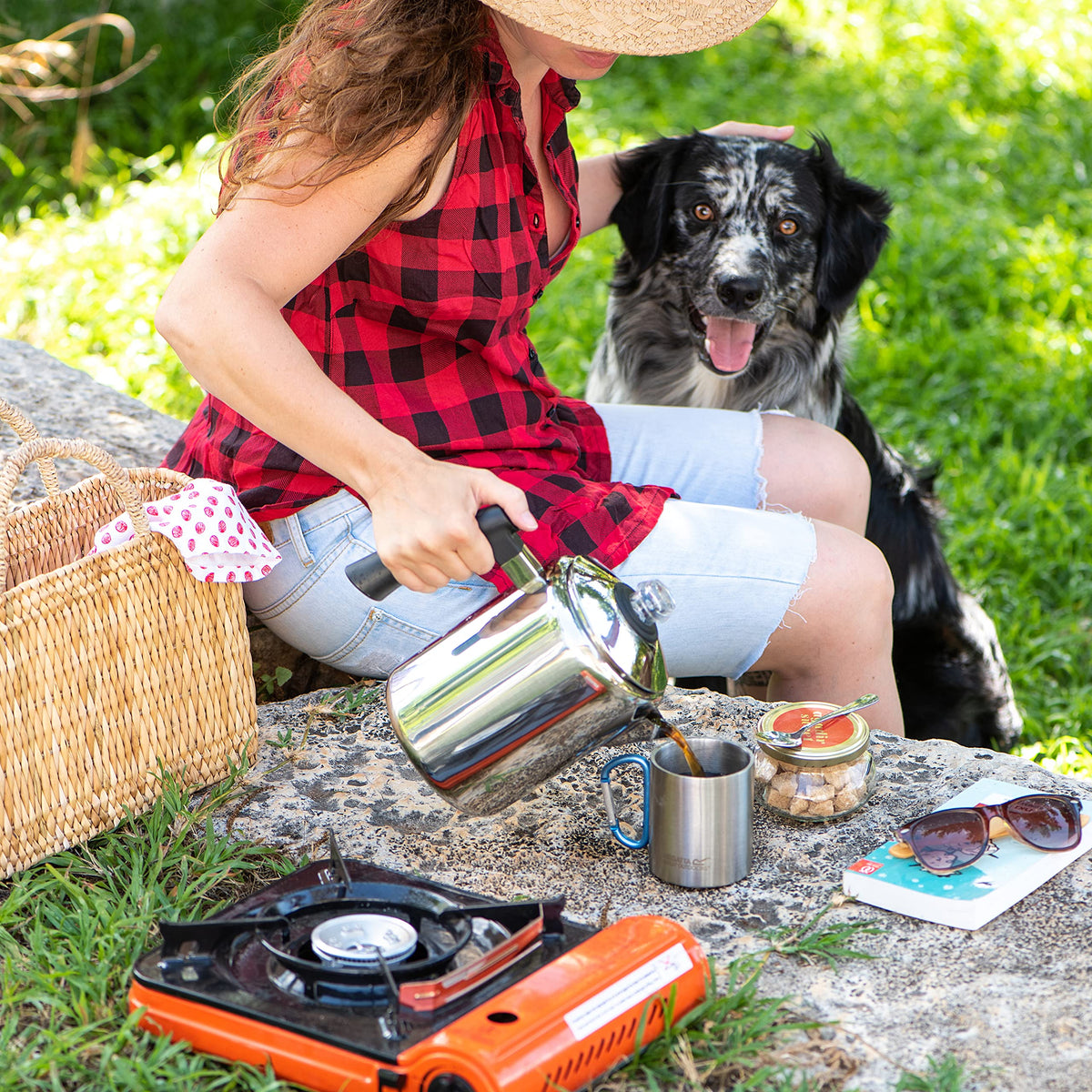 Mixpresso percolator pouring rich coffee into a mug outdoors.