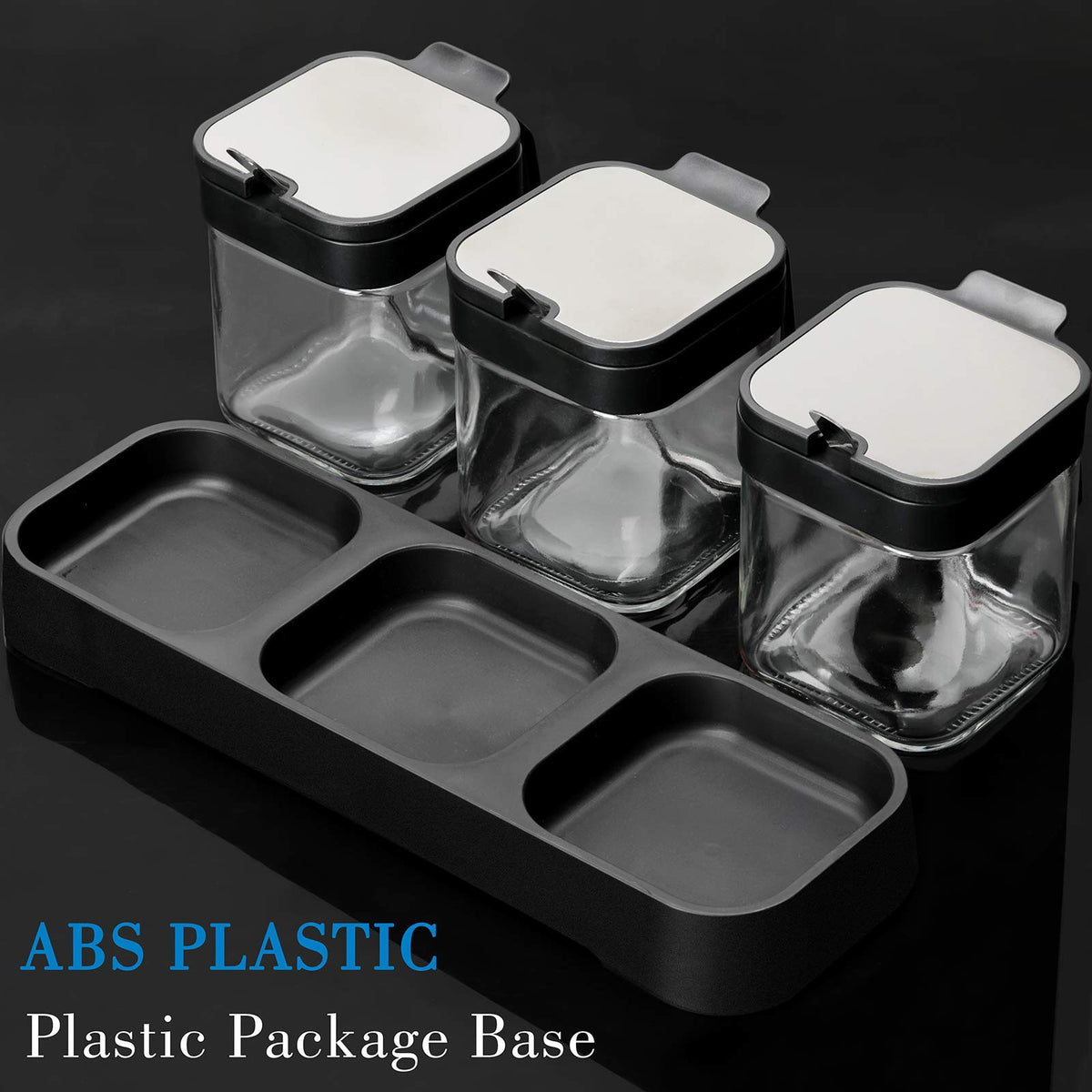 Close-up of lids and spoons on Mlici jars showing sleek stainless steel accents.