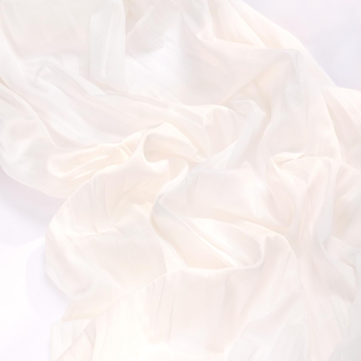 MLMC ivory cheesecloth runner used as a backdrop for a photoshoot table