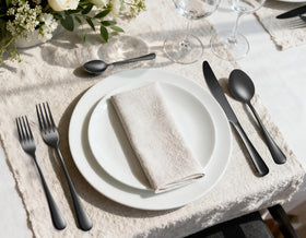 MNLWSP black spoons on a modern dining table arrangement.
