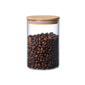 MOLFUJ 960ml glass storage jar with wood lid for organized pantry storage.