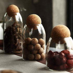 MOLFUJ clear glass container with wood lid showcases contents beautifully.