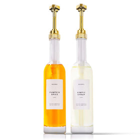 Molimoli coffee syrup dispenser with gold finish and glass bottles for organized pour control.