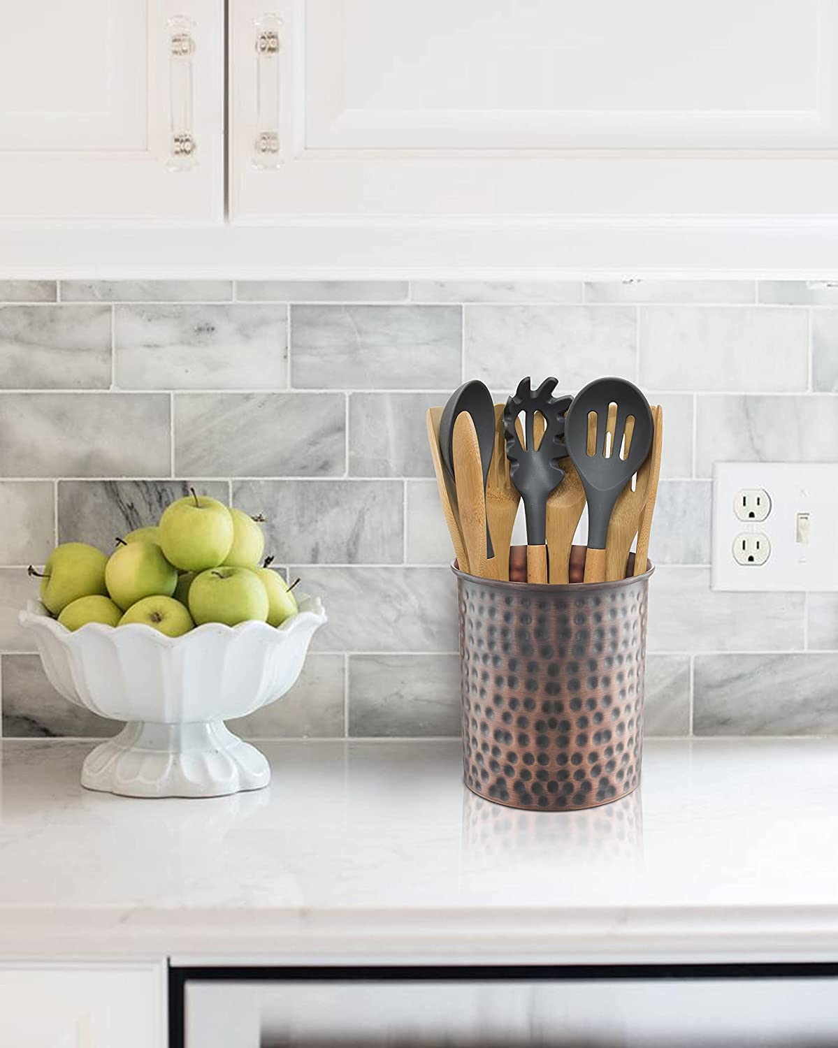 Monarch Abode kitchen counter organizer keeps spatulas, spoons, and tongs neatly arranged.