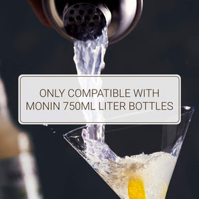Monin syrup pump dispensing 1/4oz portion for precise pours.