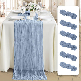 MONKRO cheesecloth table runner with crinkle gauze texture drapes elegantly across a long dining table.