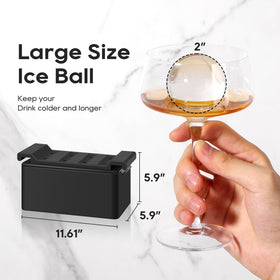 Mooues clear ice spheres enhancing a whiskey glass.