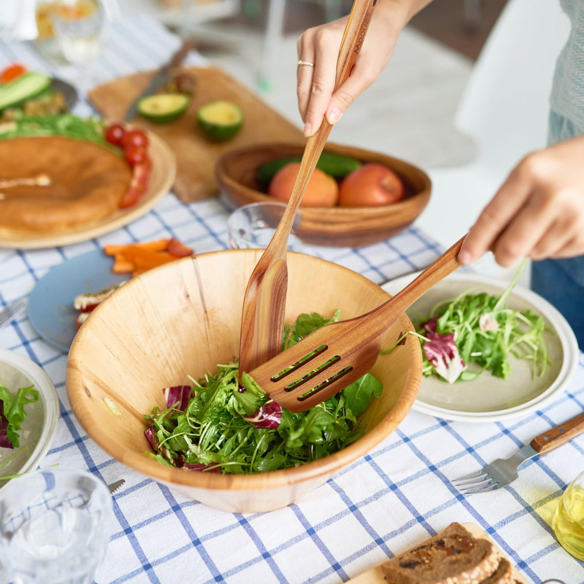 Mooues teak utensils with hanging holes for easy storage