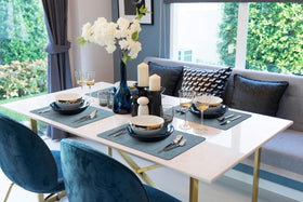 More Decor placemats blue heat-resistant surface in use during dinner