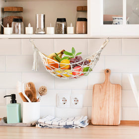 Motarna mesh storage demonstrates spacious capacity for bananas, onions, and snacks.