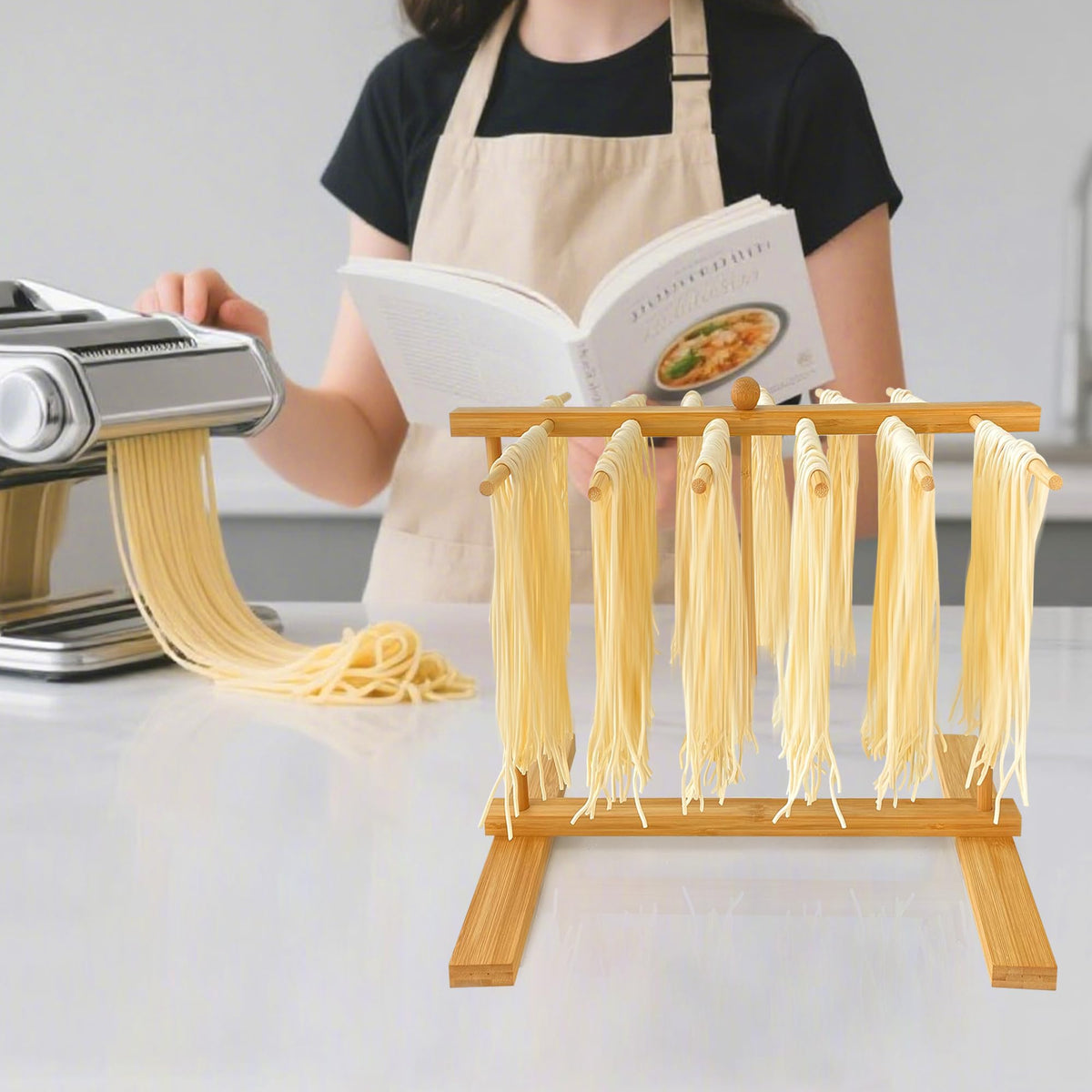 Mozphae transfer wand in action moving pasta from maker to drying rods.
