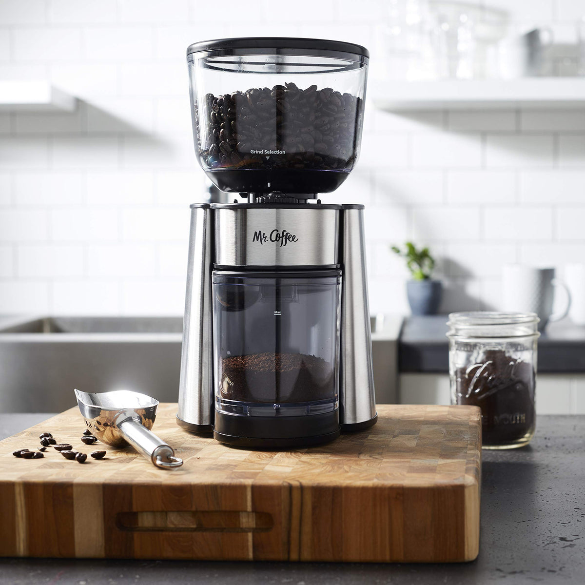 Dual safety-locking switches on the Mr. Coffee grinder for safe use.