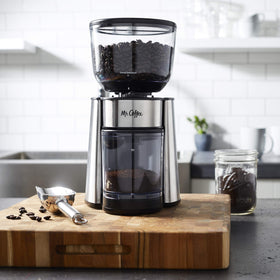 Dual safety-locking switches on the Mr. Coffee grinder for safe use.