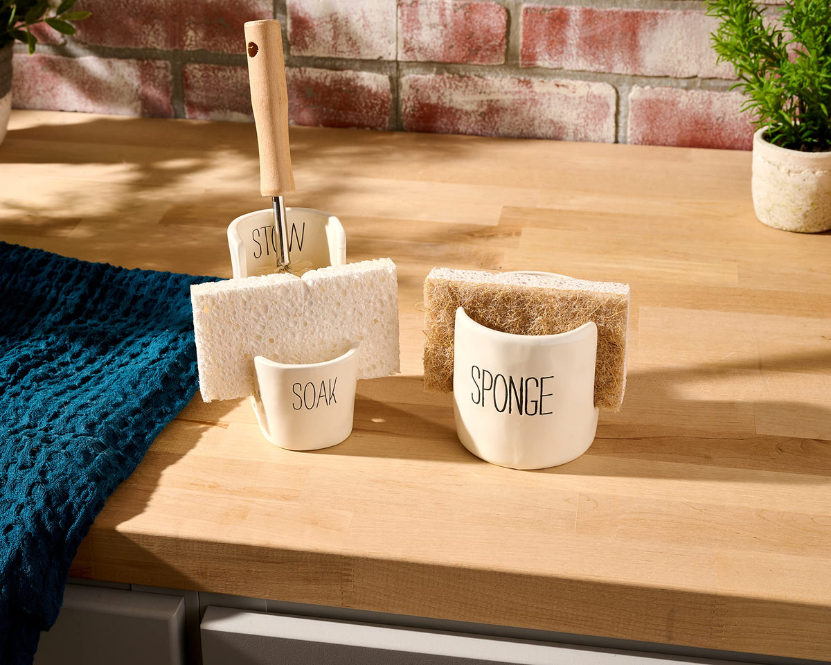 Mud Pie off-white sponge holder complements neutral countertops and busy kitchens.