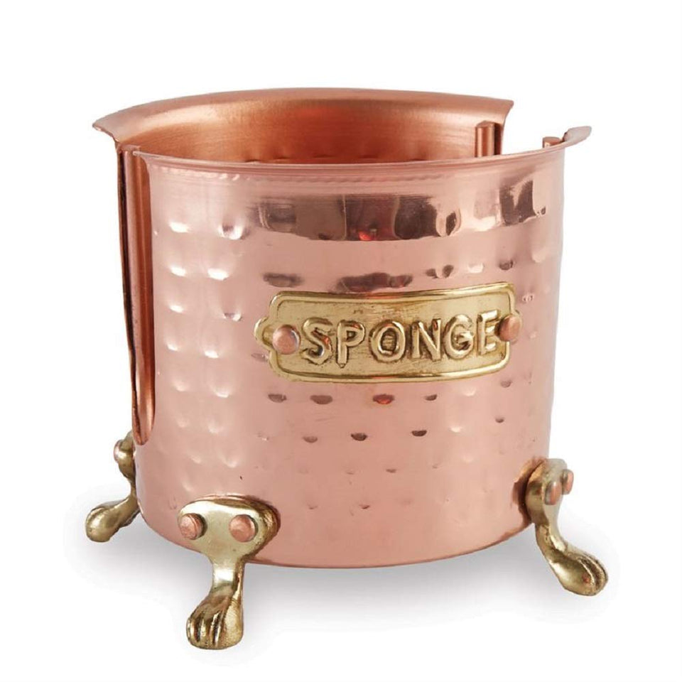 Mud Pie kitchen sponge holder in copper with gold feet beside sink