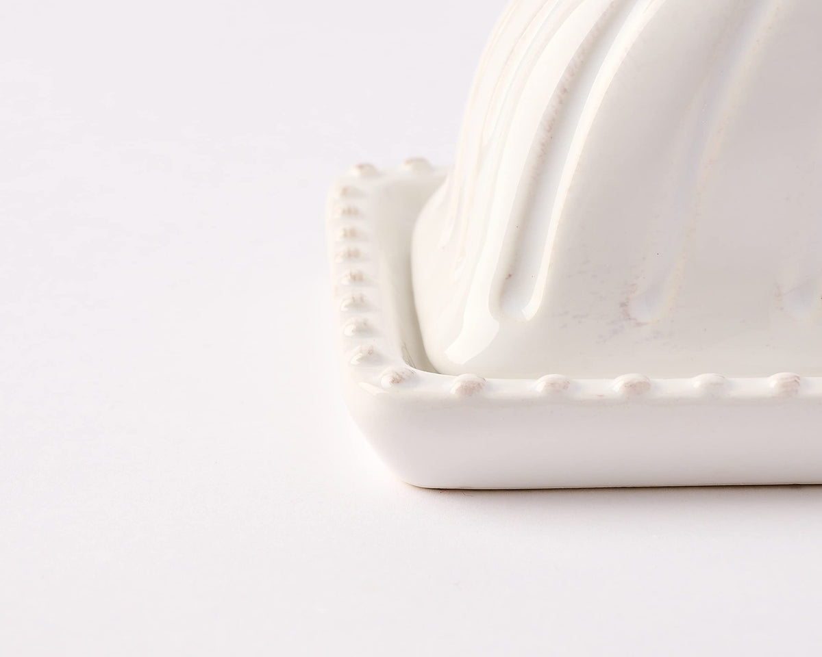 Mud Pie white ceramic butter dish on the counter offers timeless kitchen style.