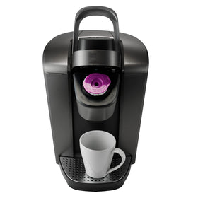 Munfix filters stacked beside Keurig basket for quick loading.