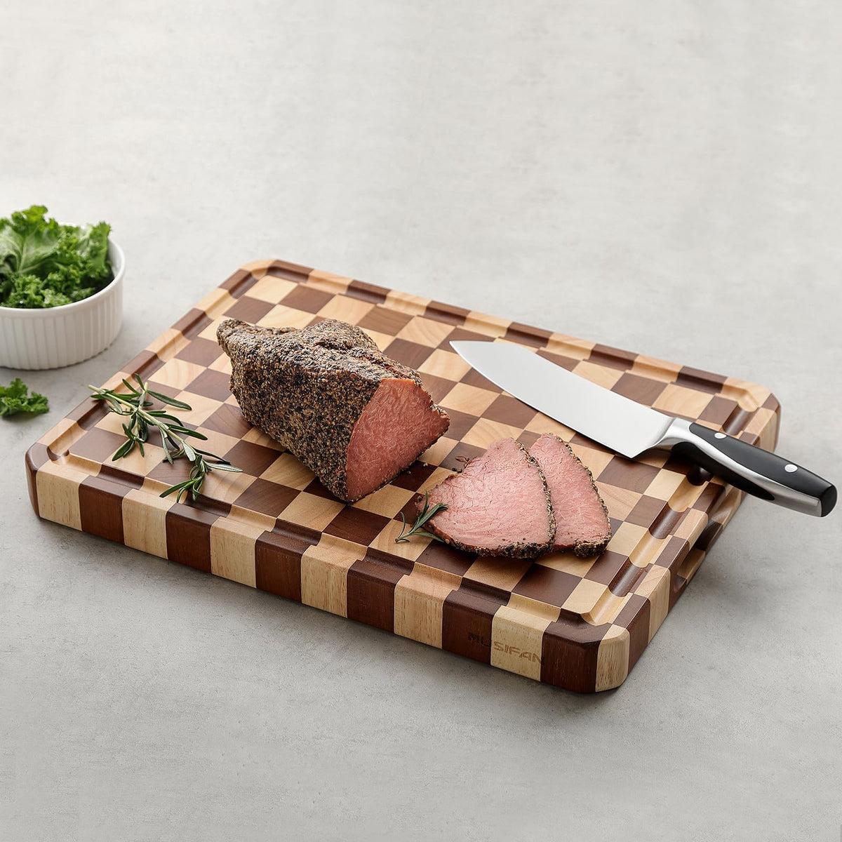 Musifan Acacia cutting board protects knife edges during chopping.