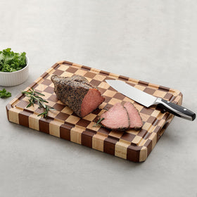 Musifan Acacia cutting board protects knife edges during chopping.