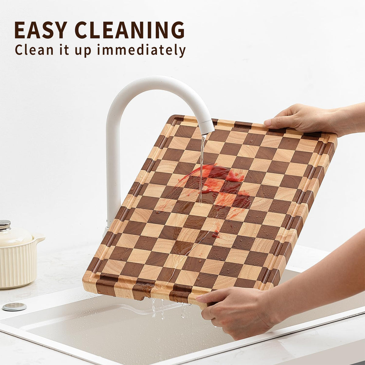 Musifan Acacia Wood Cutting Board being wiped clean with soap and water