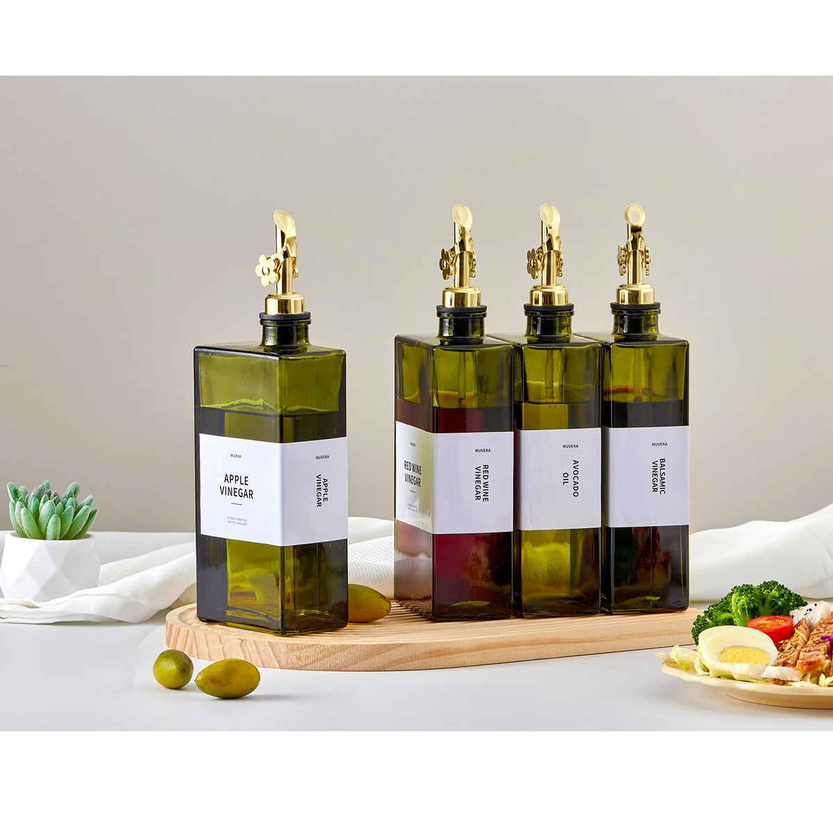 MUVEKA kitchen dispenser bottle tilted for easy, controlled pouring.