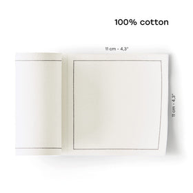 Folded MY DRAP Basics cotton napkin in cream for an elegant table setting.
