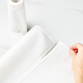 Napkin placed on dining table from MY DRAP Basics in cream for upscale ambiance.