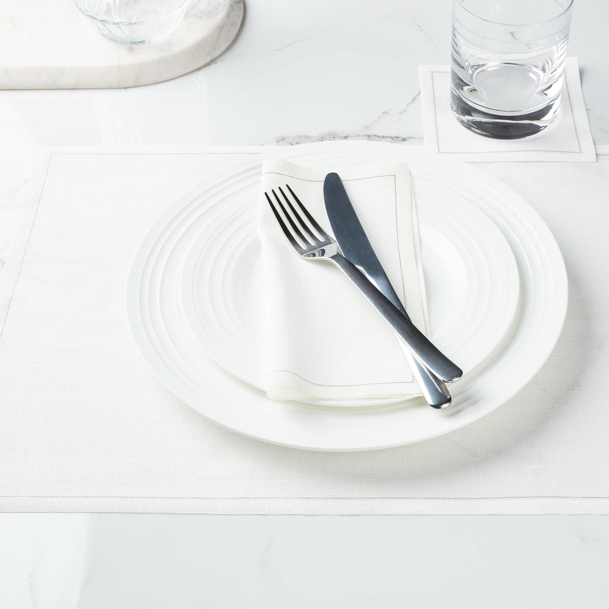 Elegant event table using MY DRAP Basics napkins in cream for versatile settings.